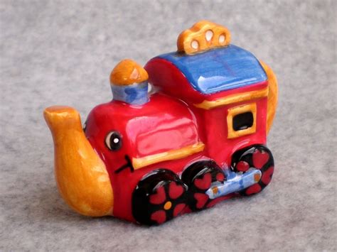 metal train in red rosetea box|red rose tea toy.